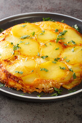 Pan haggerty is also known as potato bake or casserole it is a famous British dish from Northumberland closeup in the plate on the table. Vertical