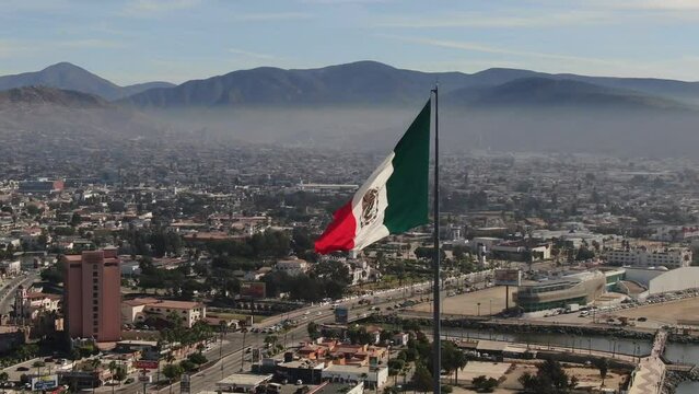 Mexican flag waving over the city of Ensenada.