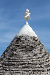 Stone roofs of Trulli Houses in Alberobello; Italy. The style of construction is specific to the...