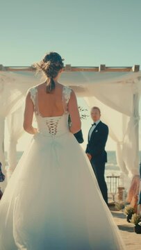 Vertical Screen: Beautiful Bride and Groom During an Outdoors Wedding Ceremony on a Beach Near the Ocean. Marriage Venue for Romantic Couple and Best Friends with Multiethnic Diverse Cultures.