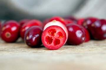 cut into half ripe red berries of garden cranberries