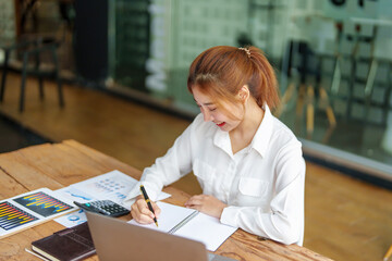 data analysis, plan, marketing, accounting, audit, Portrait of asian business woman working planning marketing using statistical data sheet and computer to present marketing plan project at meeting.