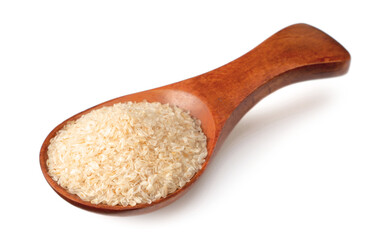 Psyllium husk in the wooden spoon, isolated on white background.