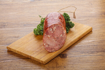 Pork ham sausage over board