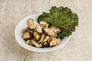 Tasty marinated mussels in the bowl