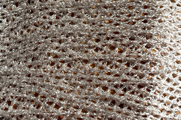 Tejido de color plateado en forma de red , textura