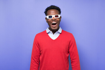 Young happy excited african positive man wear 3 D glasses watching comedy film
