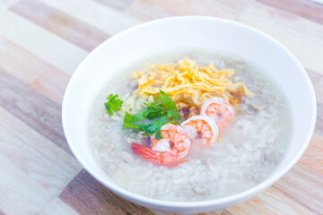 Boiled rice with pork was added on top with chopped omelet, boiled shrimp and coriander as a a...