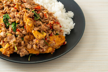 stir-fried minced pork with basil and egg topped on rice