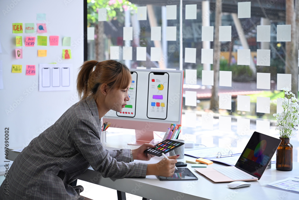 Poster creative woman is working on application development prototype wireframe for mobile phone.