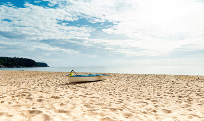 Fototapeta na wymiar Boat on the beach, travel to asia, tropical island, empty clean beach in summer seson