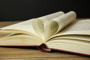 Old book with the heart shape from sheets in the middle