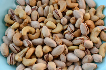 Mix of nuts on a blue plate
