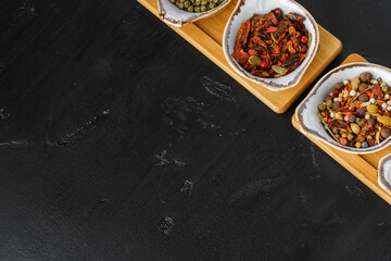 Small bowls with spices on gray background