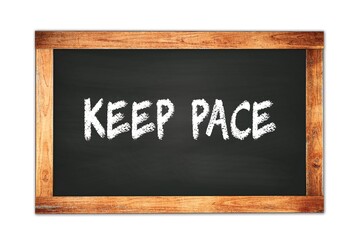 Obraz premium KEEP PACE text written on wooden frame school blackboard.