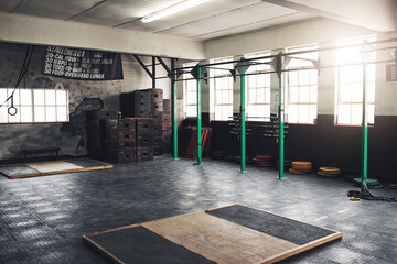 Get ready to transform your body. Sill life shot of the interior of a gym.