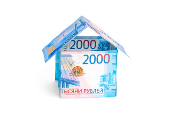 A house made of ruble notes isolated on a white background