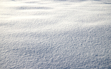 A flat area with white snow. Winter snow background