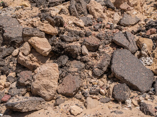A pile of broken asphalt from the old road. Close-up.