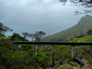 Fototapeta na wymiar Hiking on the pipe track of the Twelve Apostles, Table Mountan, Cape Town, on a rainy day
