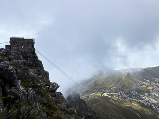 View of the Table Mountain cable car station from the top on a cloudy day.