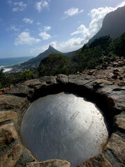 Hiking trail signs on Table Mountain, Cape Town, on a cloudy day.