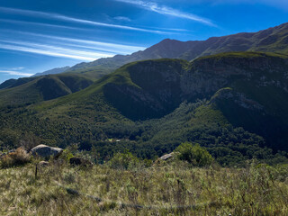 Rolling green mountains and hills on a sunny day