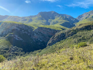 Rolling green mountains and hills on a sunny day