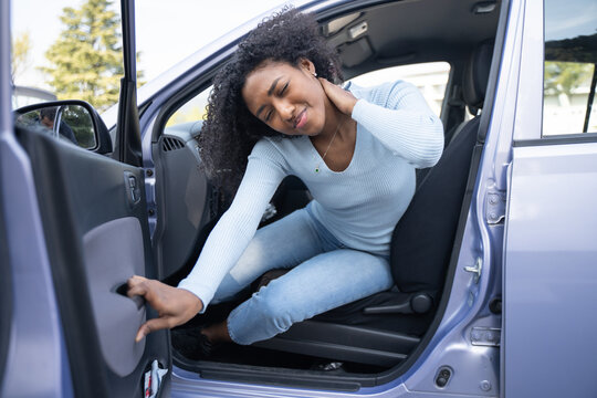 A black woman in a car after a accident