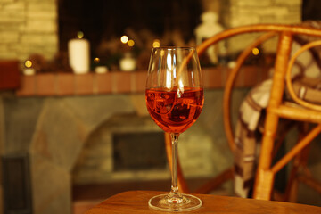 Composition with glass of wine in cozy winter evening