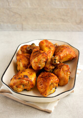 Roast chicken drumsticks on plate
