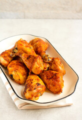 Roast chicken drumsticks on plate