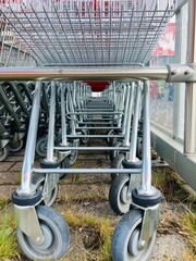 unused shopping carts pushed into each other in a station