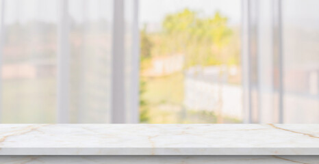 Empty marble table top with blur window curtain background