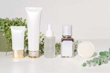 moisturizing cream bottle over leaf background studio, packing and skincare beauty concept