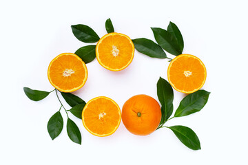 Orange fruit with green leaves on white background.