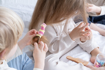 two kids boys braids pigtails using colorful elastic bands for hair for little girl sister