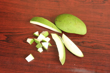 Fresh Green Mango fruit  isolated on Wood background
