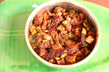 Fresh Green Mango fruit Pachadi isolated on Green background