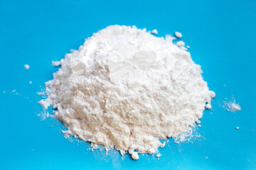 Baking soda on blue background.