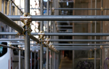 Construction to hold the scaffolding on a building in Naples, Italy