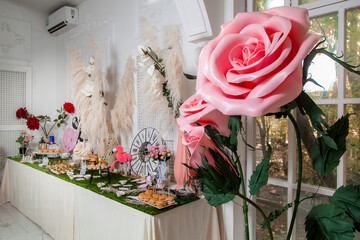 Decorated catering banquet table with different food appetizers assortment on a party