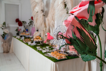 Decorated catering banquet table with different food appetizers assortment on a party