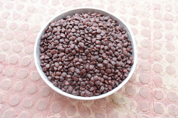 Tamarind seeds isolated on floor background