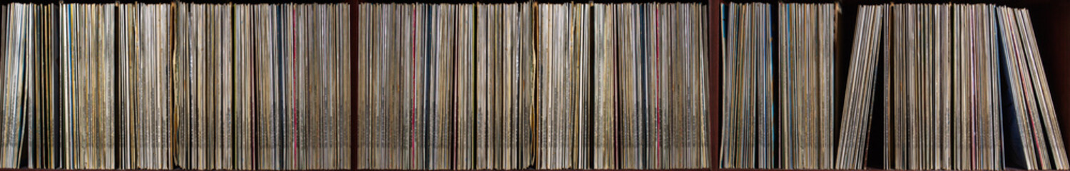 shelf with a lot of old vinyl discs