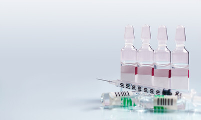 medical syringe and medicine for injection on white background