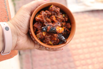 Fresh Green Mango fruit Pachadi isolated on Wood background