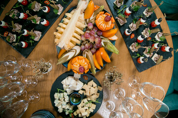 Decorated catering banquet table with different food appetizers assortment on a party