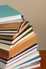 Close-up of background stack of old used books. Pile of vintage old books. Back to school