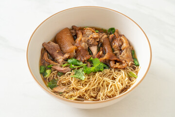 Stewed pork leg noodles in brown soup